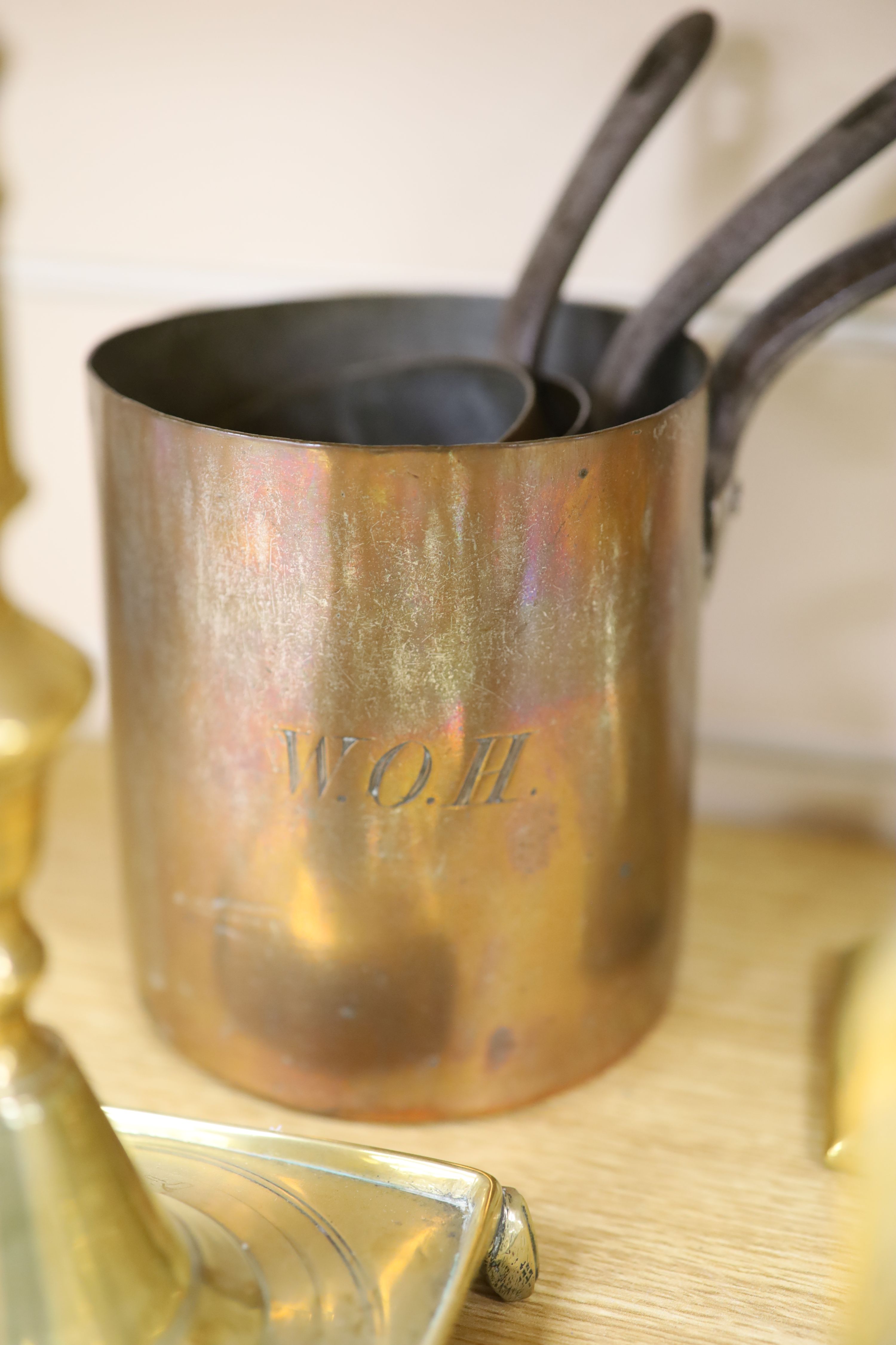A quantity of mixed brass and three copper measures